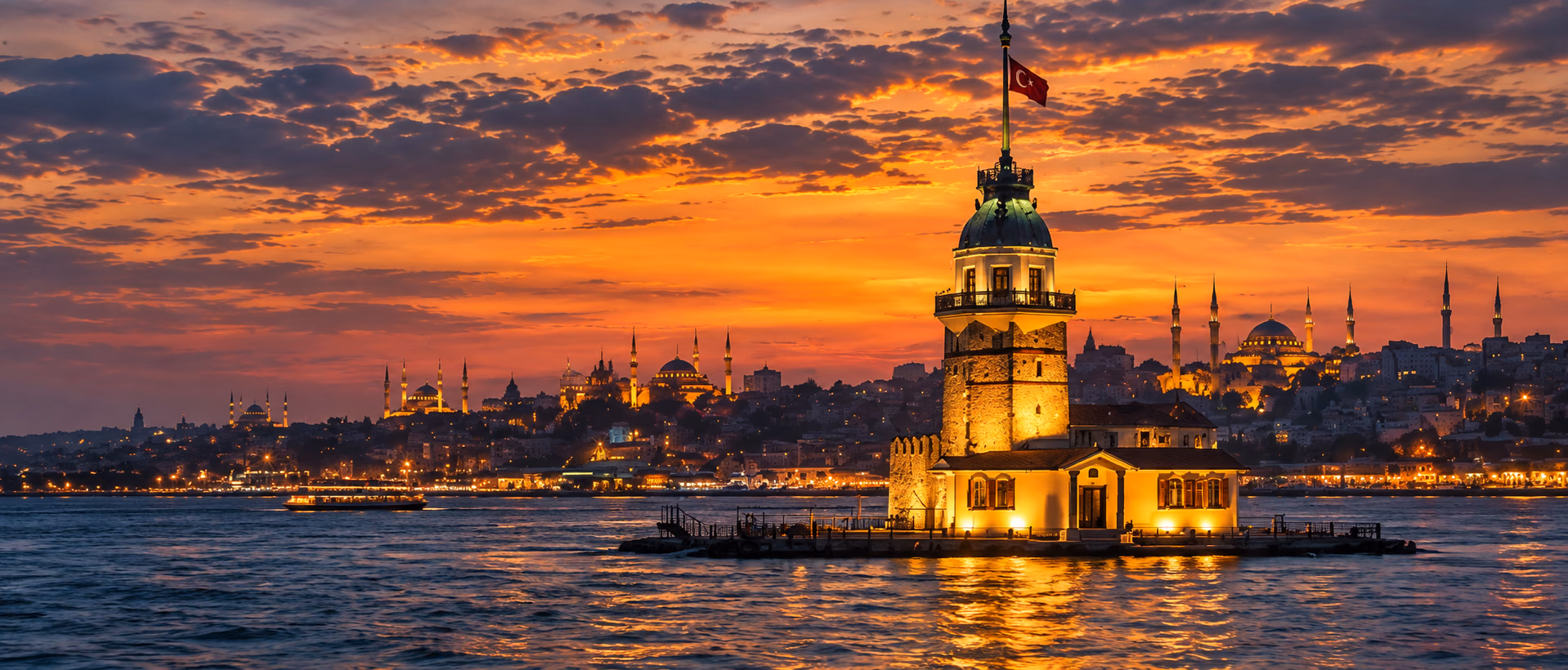 The Maiden’s Tower on the Bosphorus against an amber sunset.