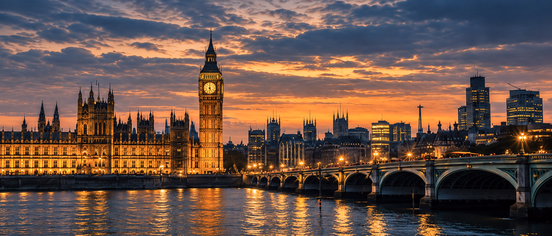 The Houses of Parliament reflected in the Thames at night.